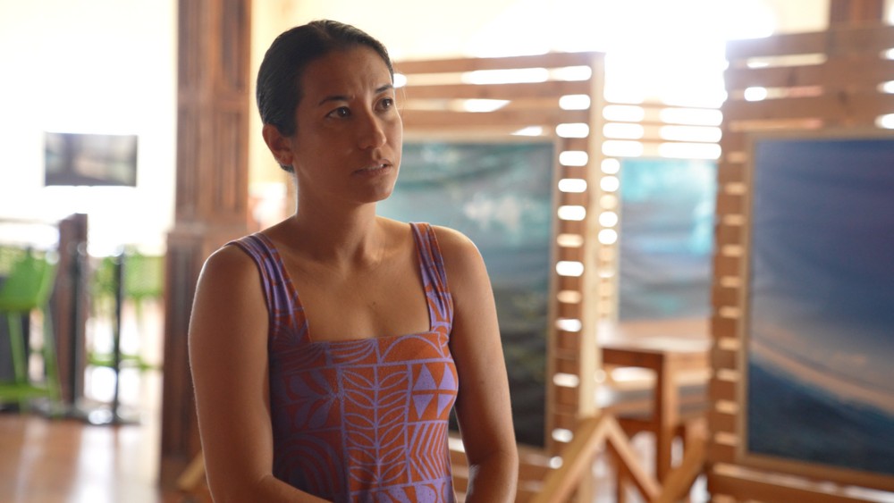 a person sits down and speaks to a camera during an interview