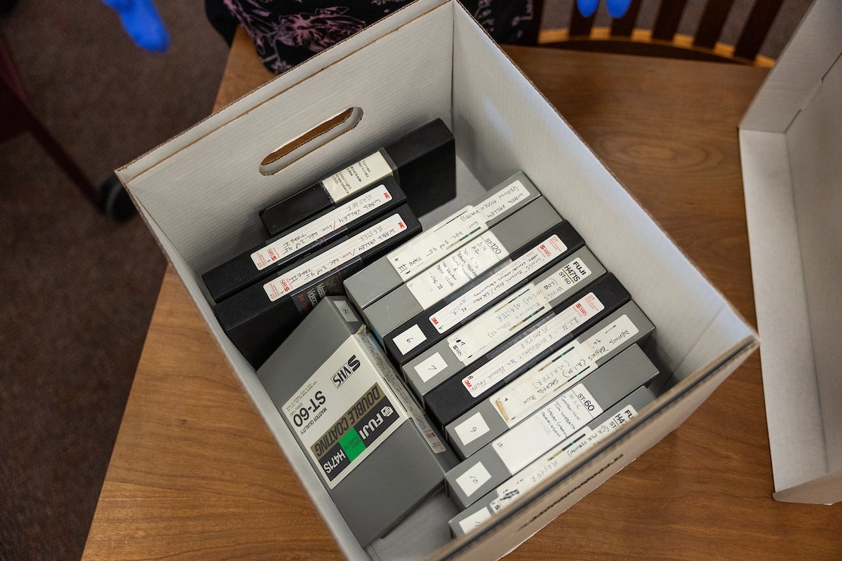 Box full of VHS videotapes.
