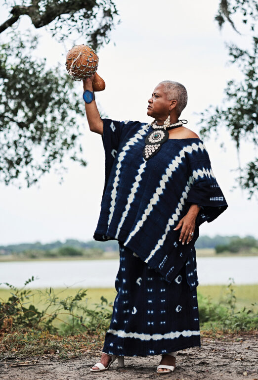 Gulla Geechee Storyteller Lillian Grant Baptiste holds a decorative gourd